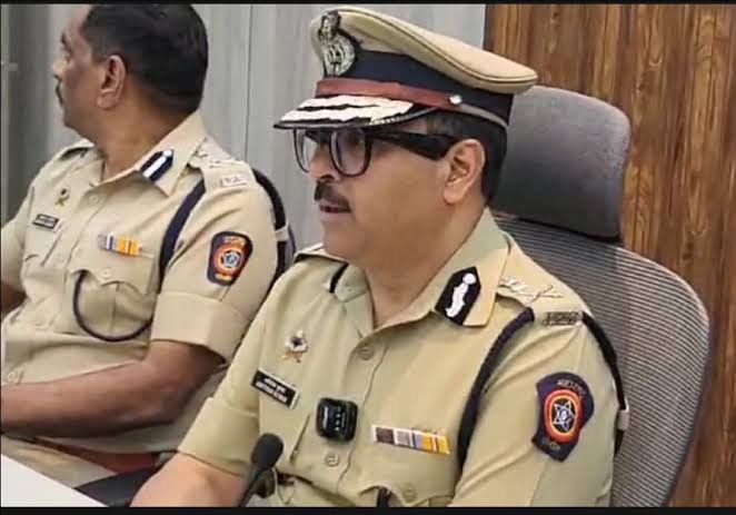 Amitesh Kumar seated beside a senior officer during a departmental review