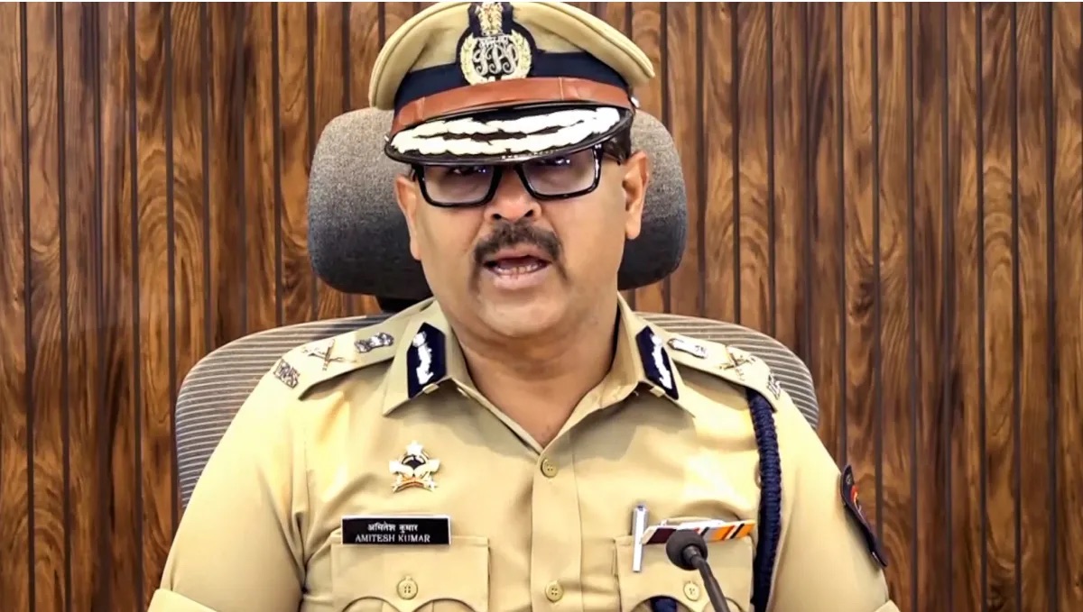 Amitesh Kumar, IPS, in Maharashtra Police uniform with his name badge visible, addressing a press briefing