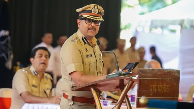 Amitesh Kumar speaking at a Pune Police public event alongside other officers