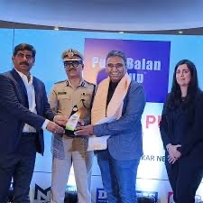 Amitesh Kumar being presented with a memento at a public forum